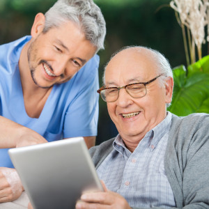 Elderly man and caregiver