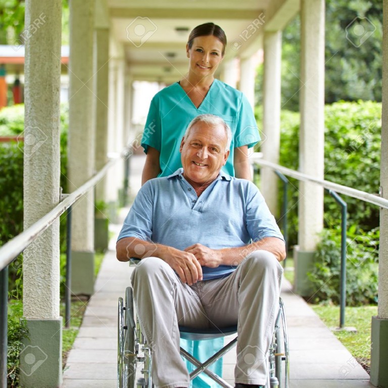 17853940-Happy-nurse-pushing-wheelchair-with-senior-man-in-hospital ...